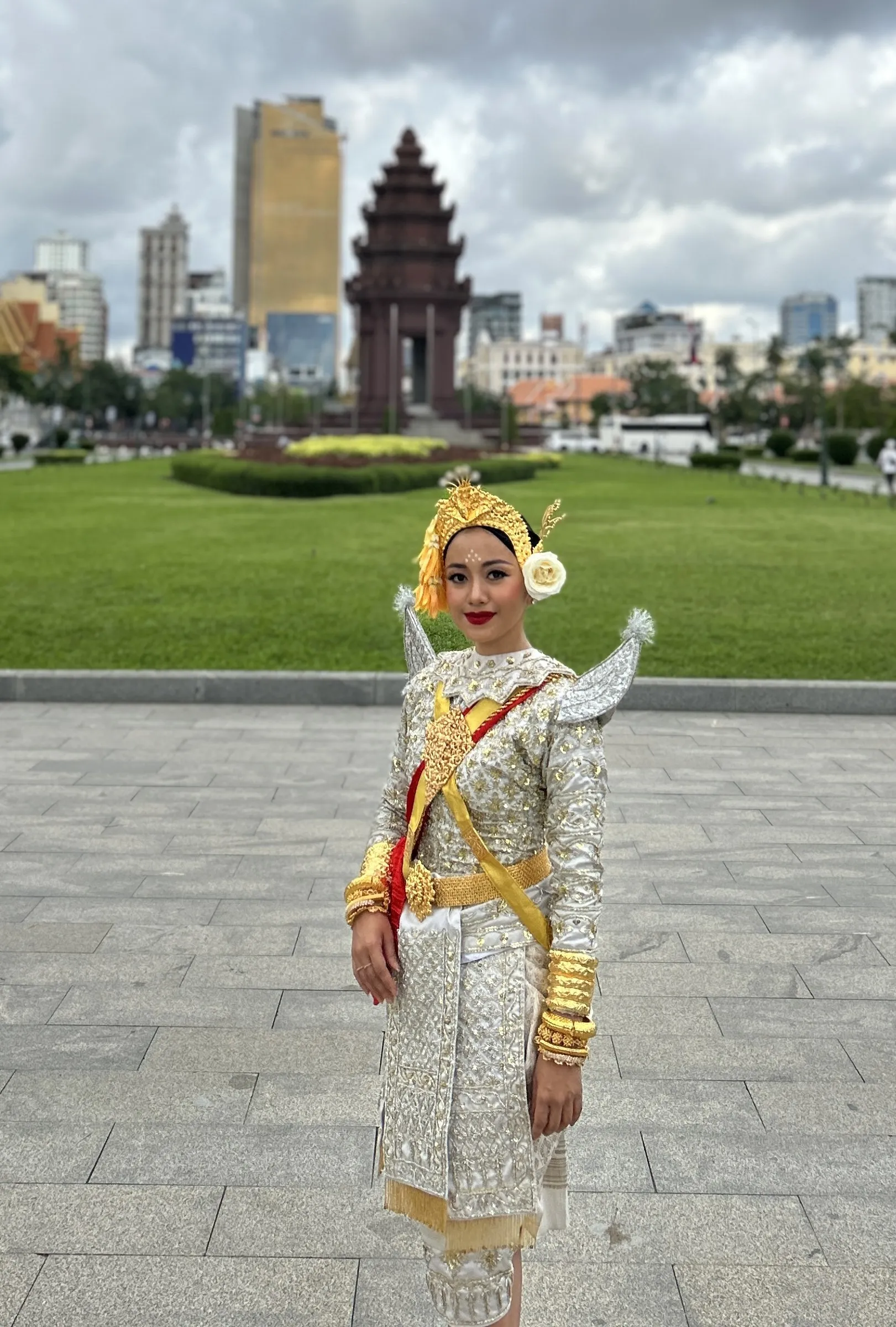 Serei Van Kosaun in costume before Independence Monument, Phnom Penh